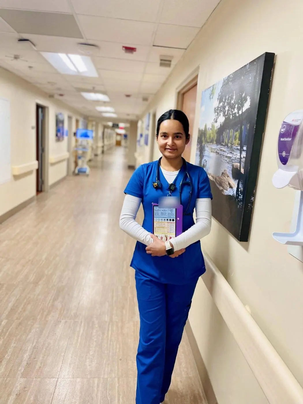 Sabina Uprety, RN, a KL Health nurse, standing in a hospital corridor