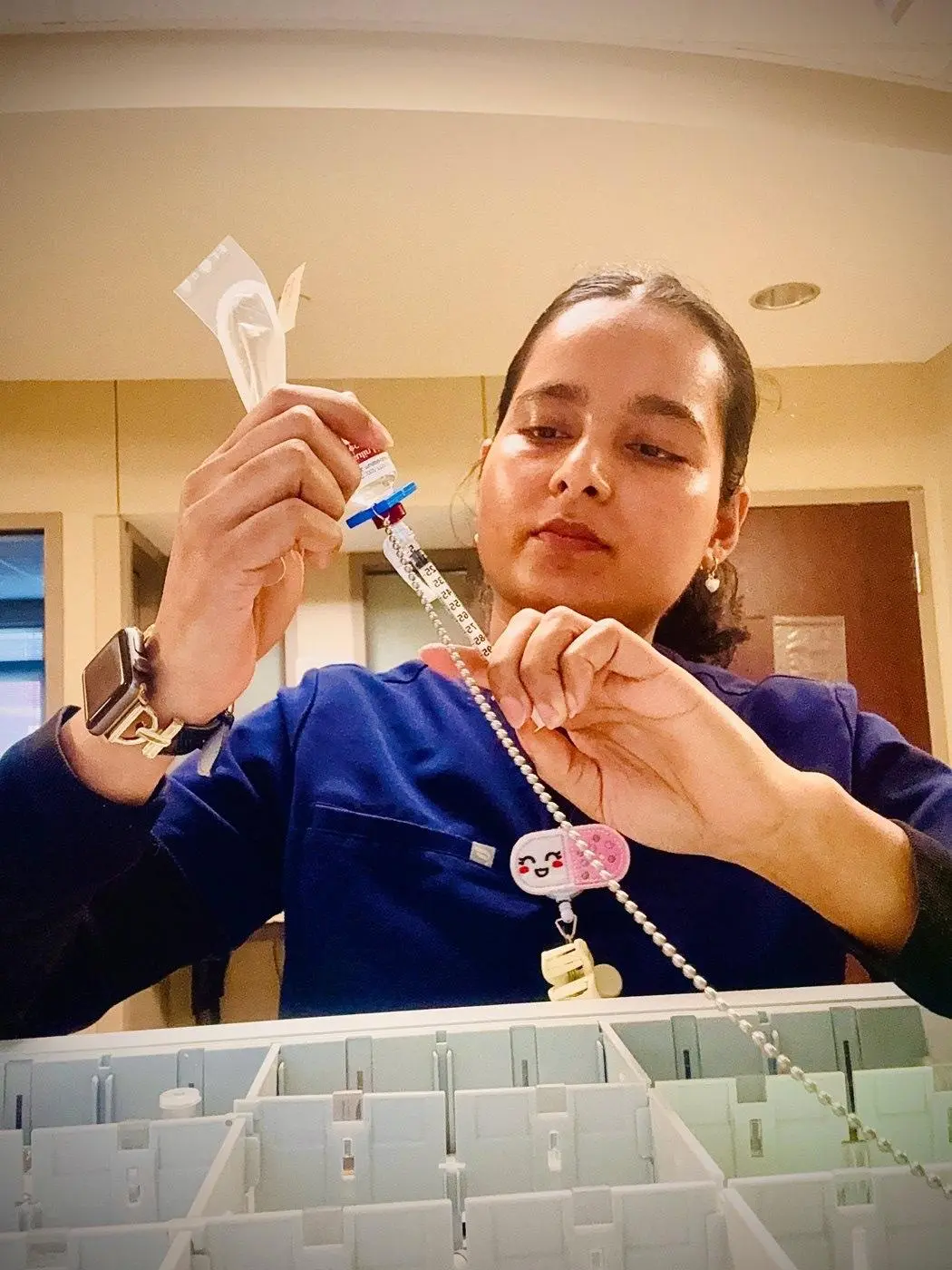Sabina Uprety, RN, preparing medication